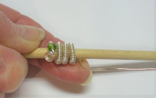 Judy Larson's Coiled, Beaded Slide - , Contemporary Wire Jewelry, Coiling, Coiling Wire, Wire Coiling, bead and coil end to the mandrel and tightly